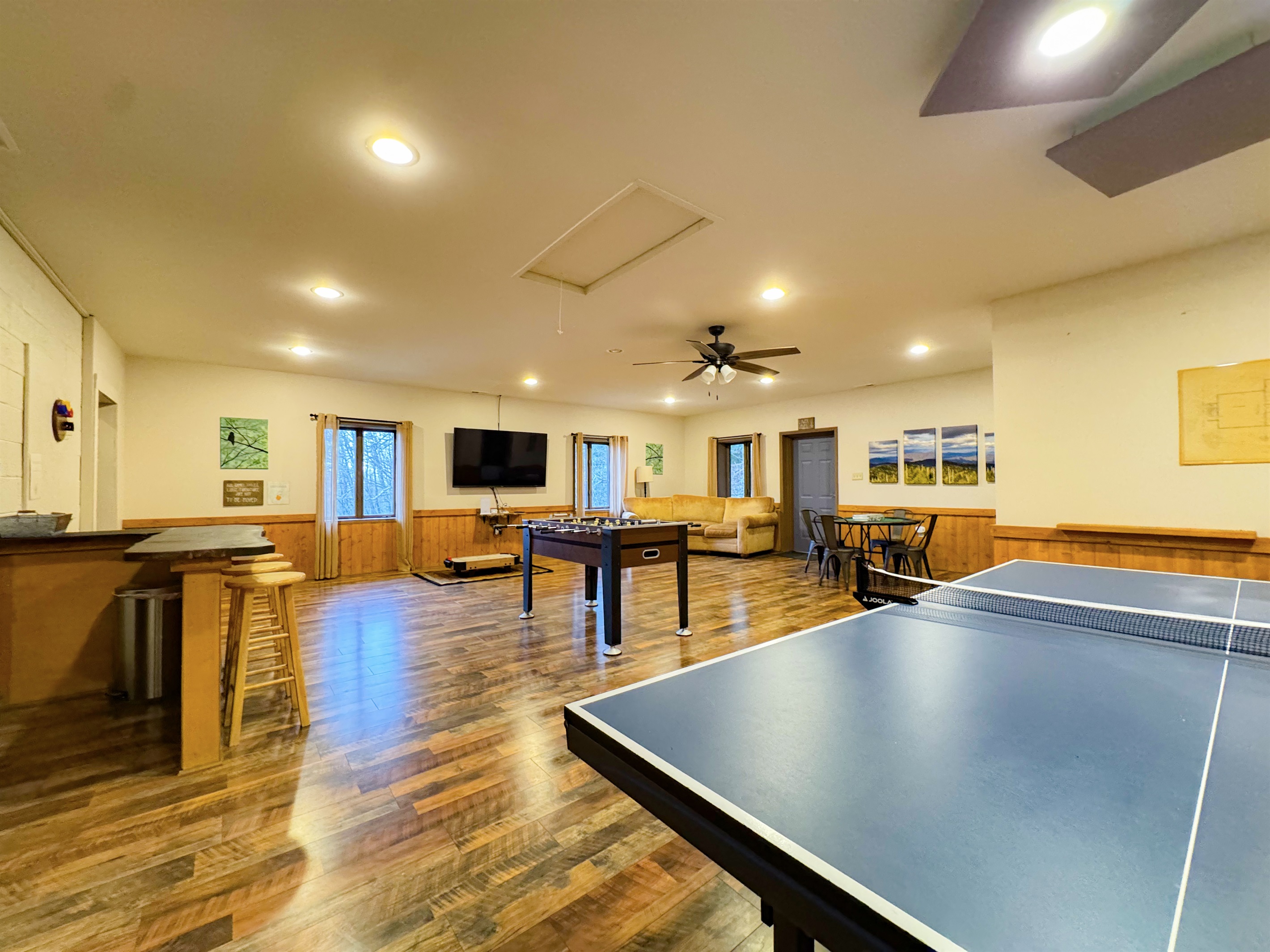 Our game room features foosball, ping pong table, ring toss, card table, kids's air hockey(floor model), Smart TV, kitchenette, bathroom, sauna, and more.