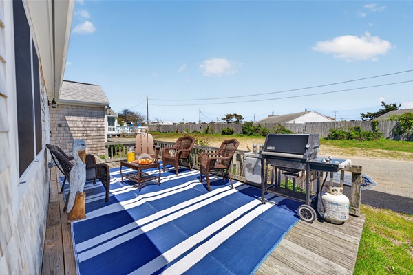 Outdoor dining area with grill setup, ideal for shared meals and summer evenings.