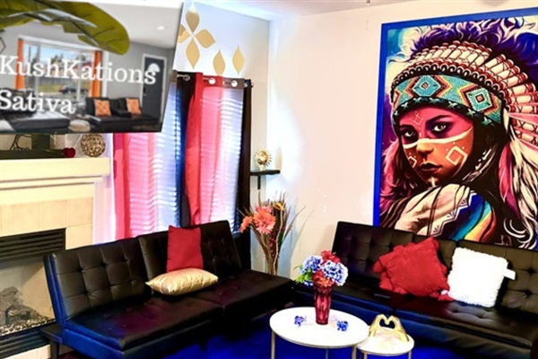 The living room is colorful with a striking mural, black sofas, a blue rug, and a fireplace. A hanging chair and red curtains add to the decor, while a small table with vases and a metal wall