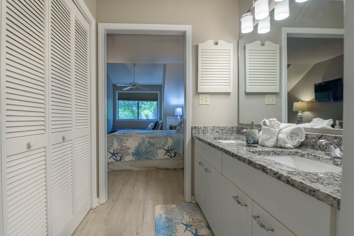Main bathroom with double sinks and tub/shower combo