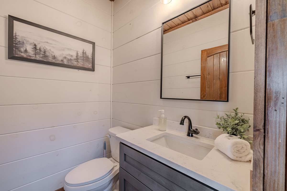 Convenient half bath located near the main living areas.