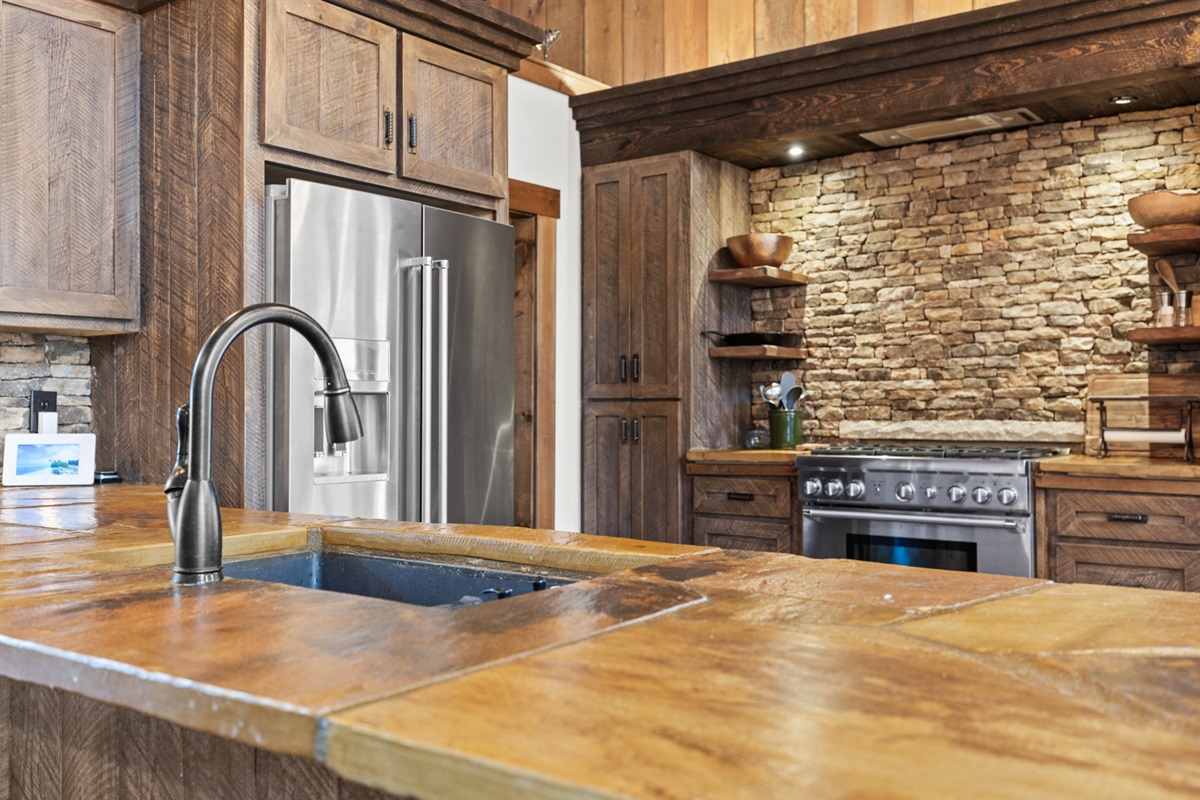 The large island provides extra prep space and seating, making it the perfect spot for casual meals or mingling while cooking.