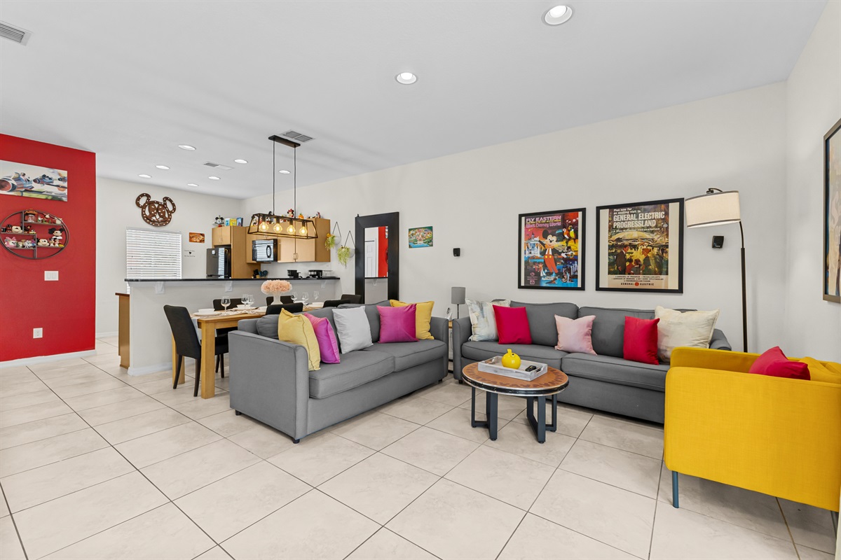 Bright open-concept living room with smart TV and comfortable seating for the whole group