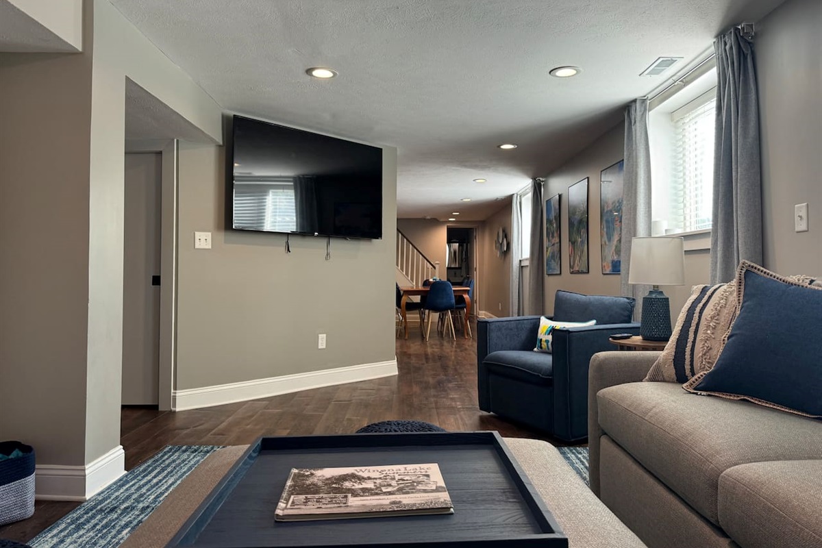 Enjoy a movie night with plenty of comfortable seating and a 65" Roku smart TV.