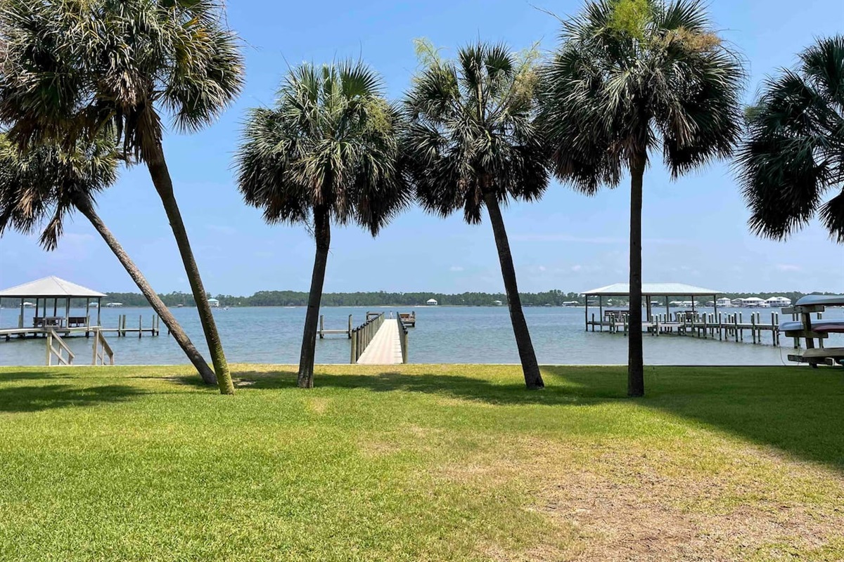 A beautiful lagoon just steps away from the condo, offering serene waters, palm trees, and peaceful docks.