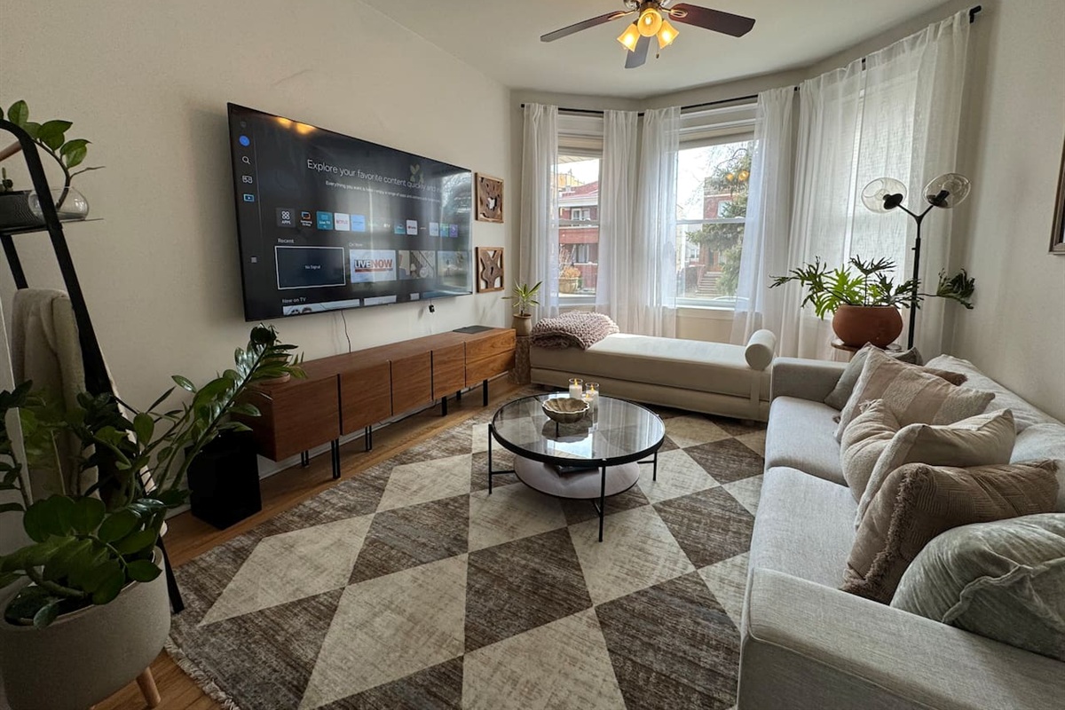 Large living room with smart TV and plenty of space to relax.