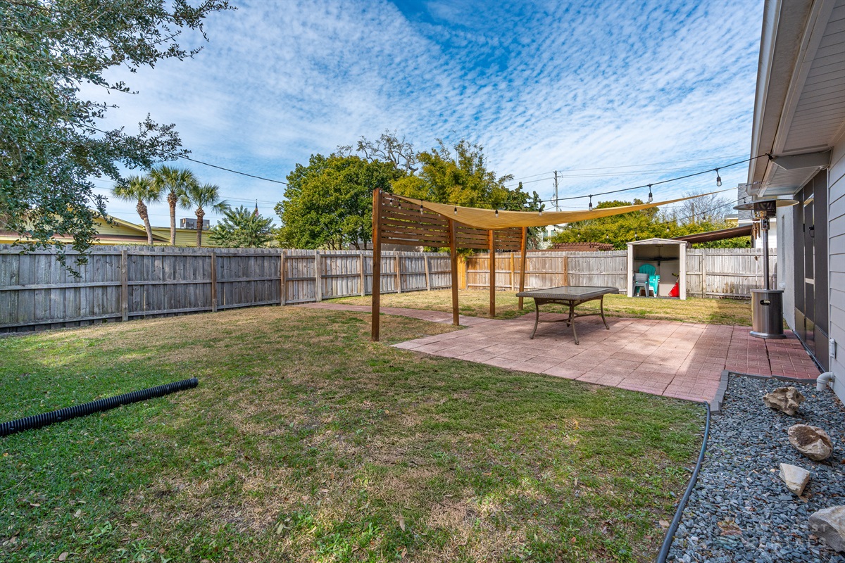 Fully Fenced Backyard with string lights
