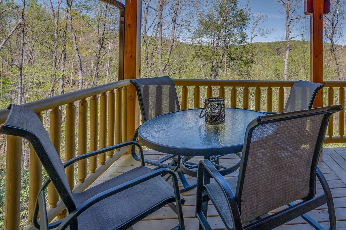 Outdoor dining- beautiful at night - Large gas grill located to the left on the deck for easy transfer of food to the table. 
