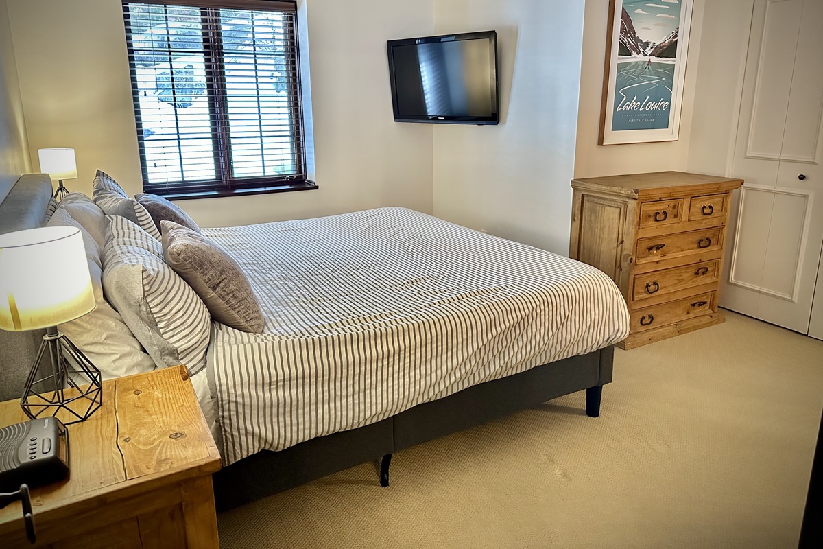 King size bed with smart TV and ensuite bathroom