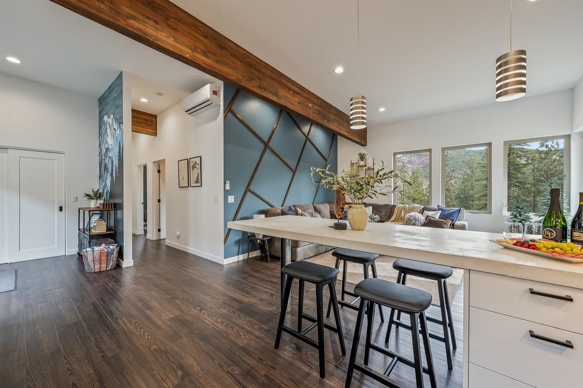 Spacious open layout with living room, fully loaded kitchen, island with dining seating for 4