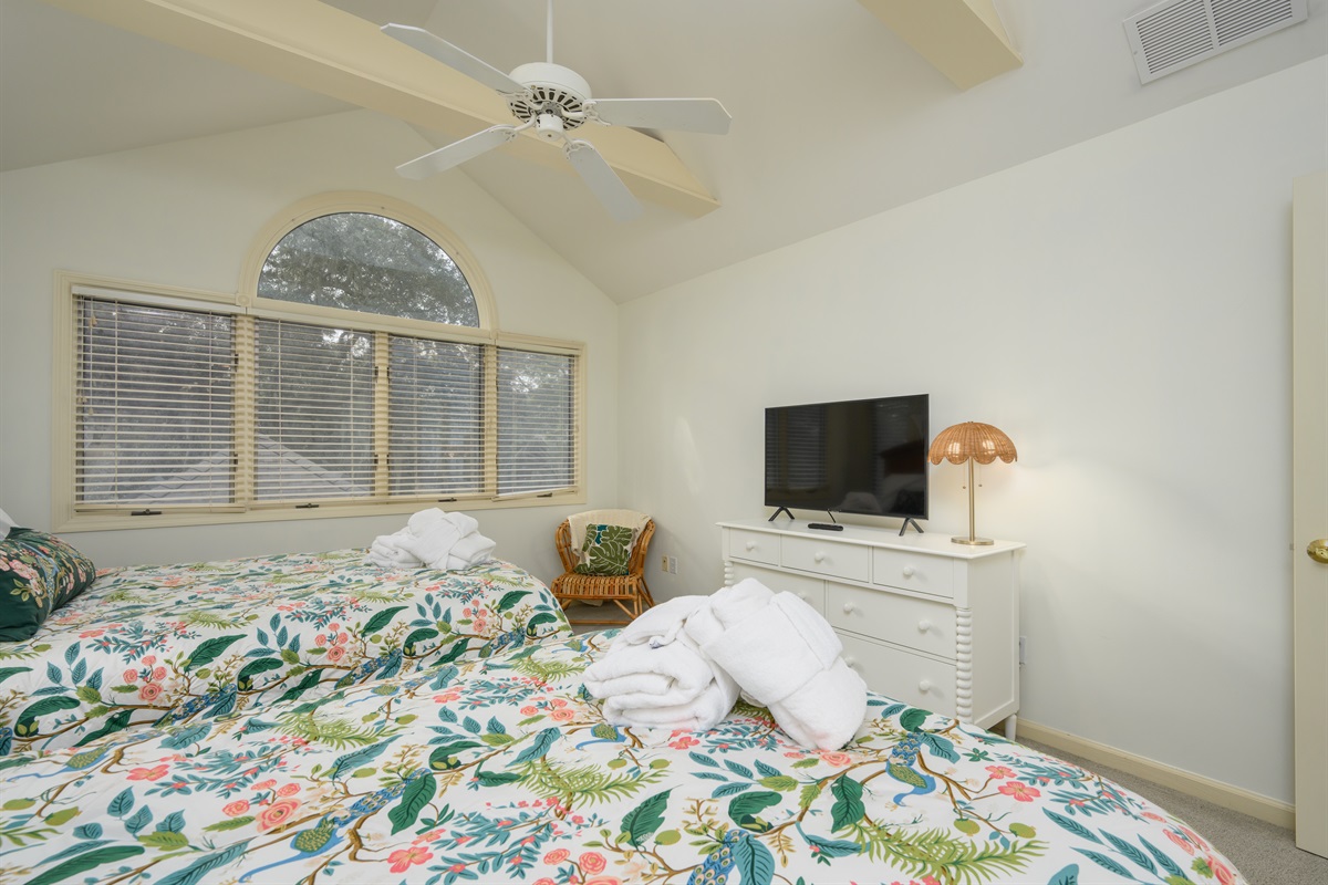 Double Queen bedroom features vaulted ceiling and tons of natural light