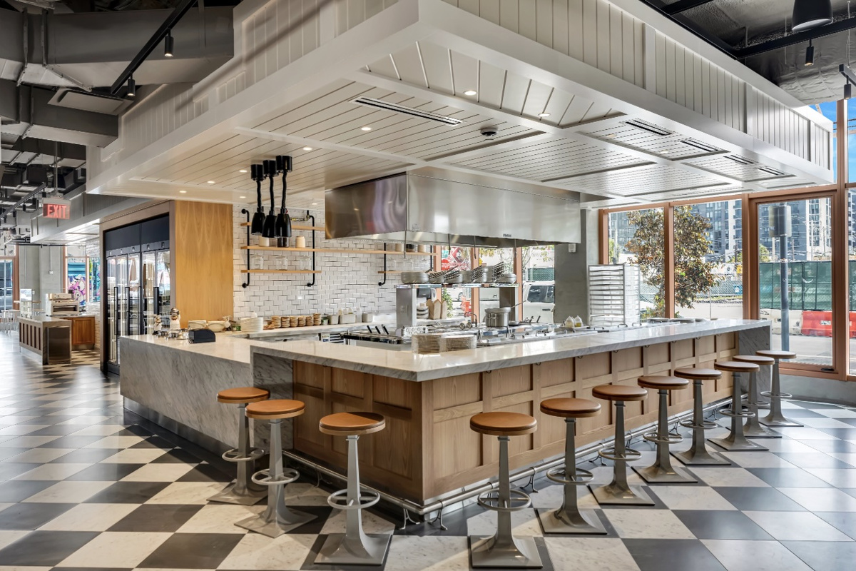 Sip and socialize at the resident coffee and cocktail bar - counter seating, warm lighting and a barista-worthy setup.