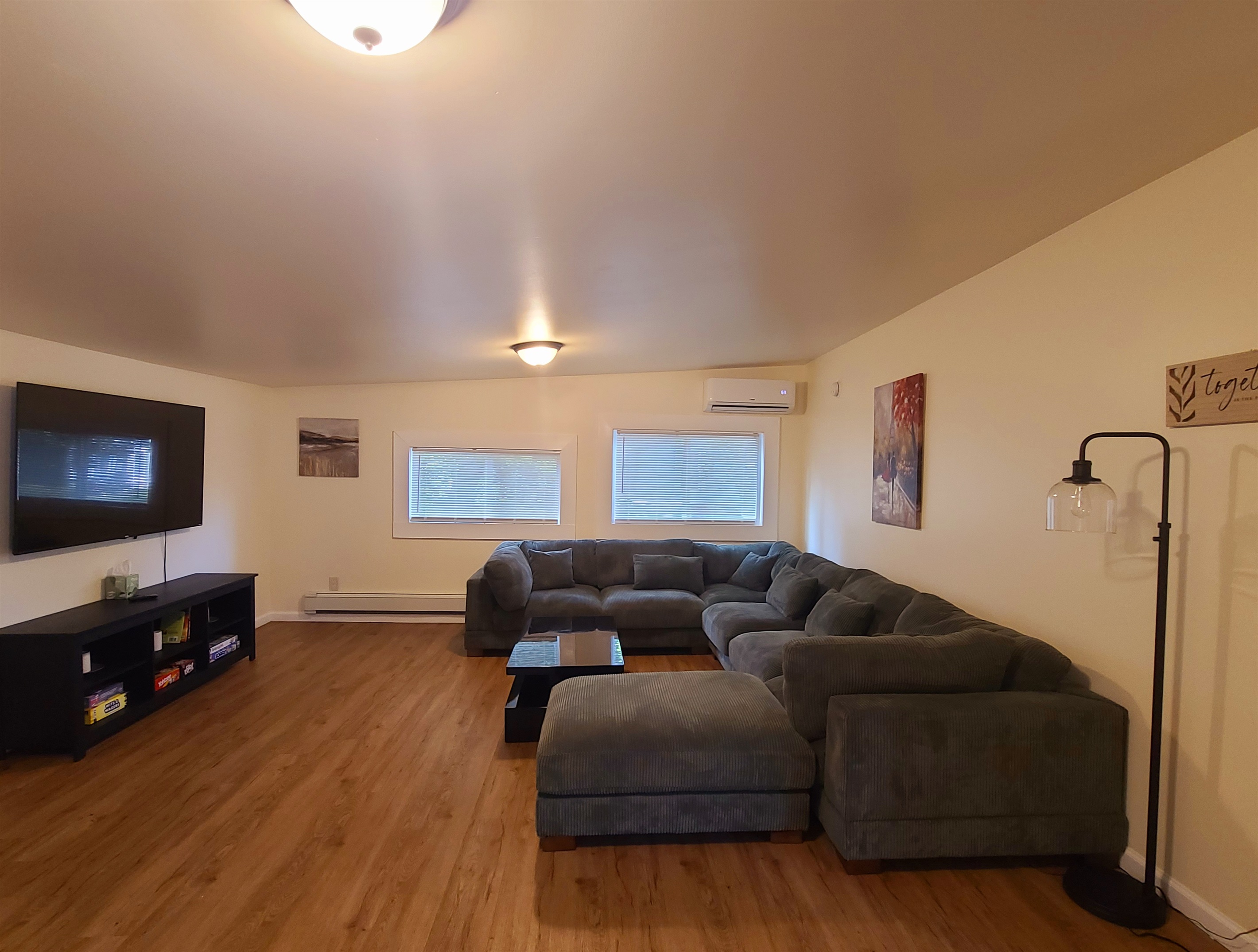 NEW LISTINGS - Large sectional in living room with SmartTV