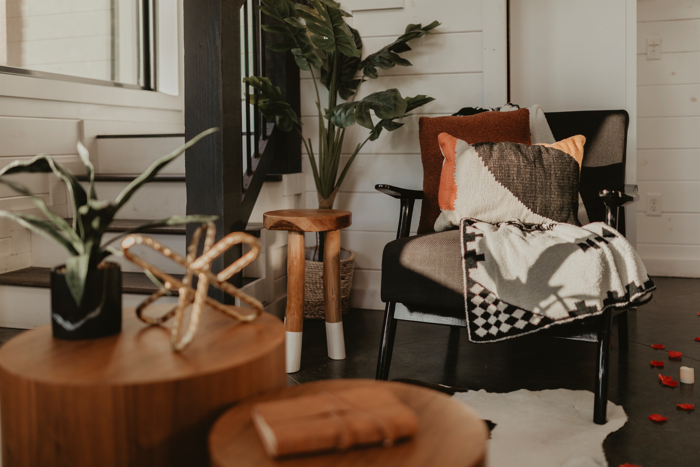 A cozy corner that feels like a warm hug—layered textures, soft throws, and modern rustic touches set the scene for slow mornings and peaceful moments.