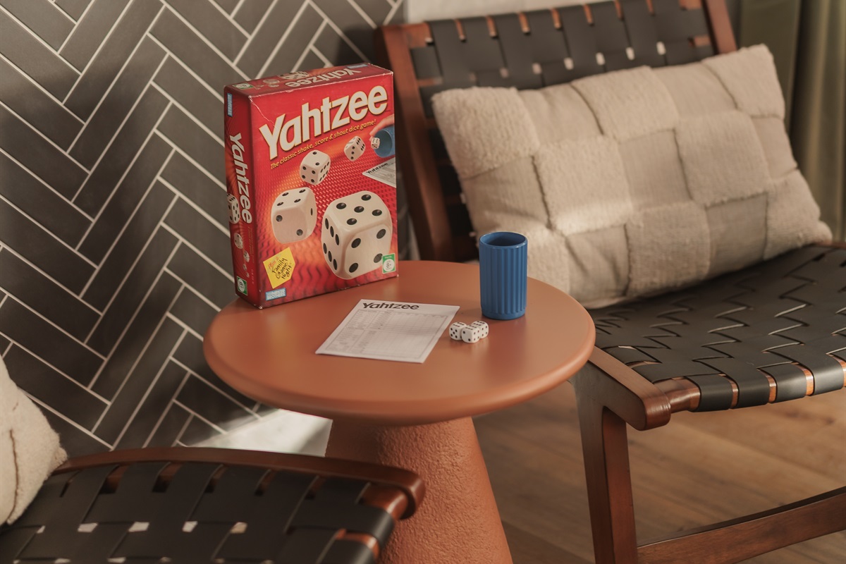 Game night starts here: comfy chairs and a classic round of Yahtzee to keep the laughs going.