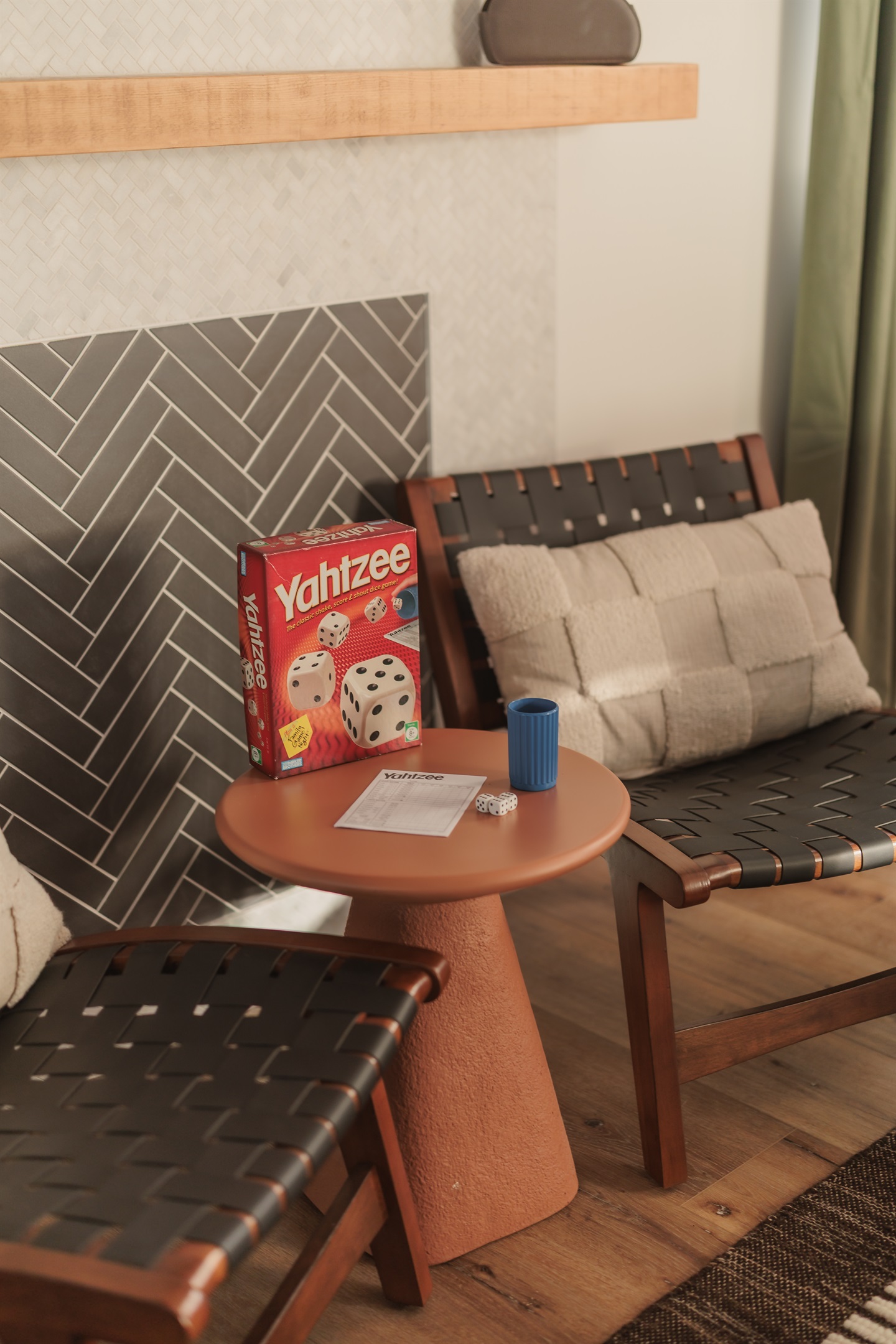 Game night starts here: comfy chairs and a classic round of Yahtzee to keep the laughs going.