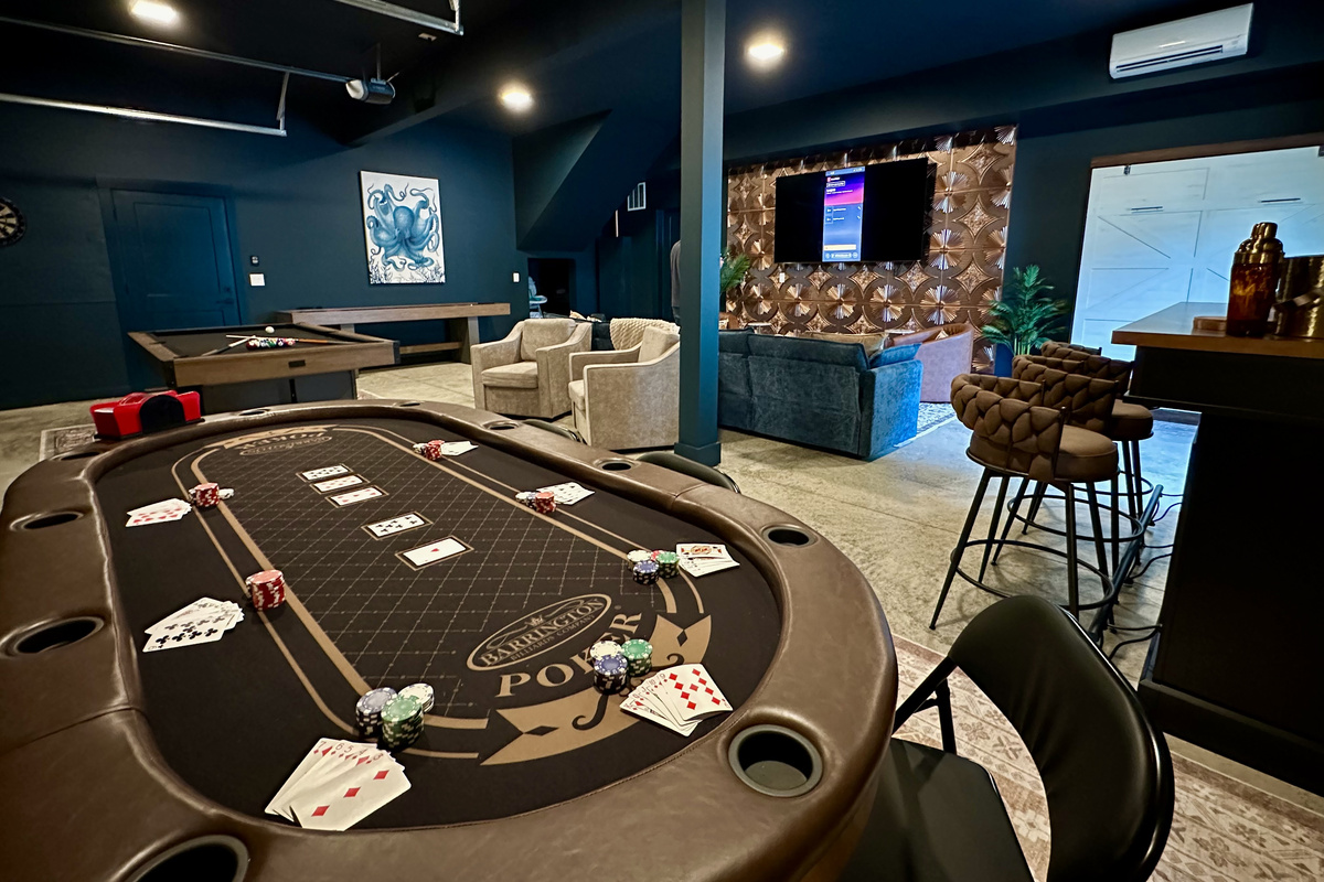 Room to roam downstairs: cards on one side, movies on the other, bar seating in between.