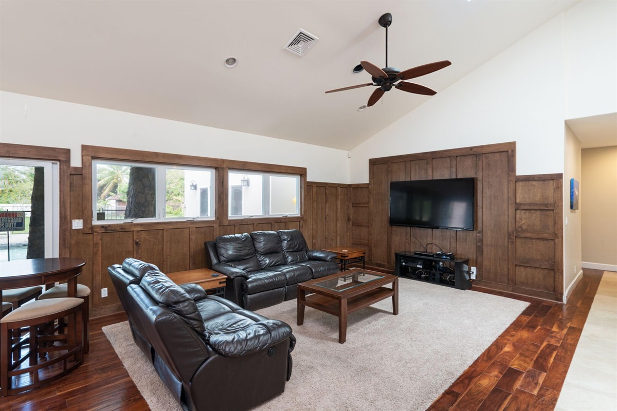 Living room area with 70in TV
