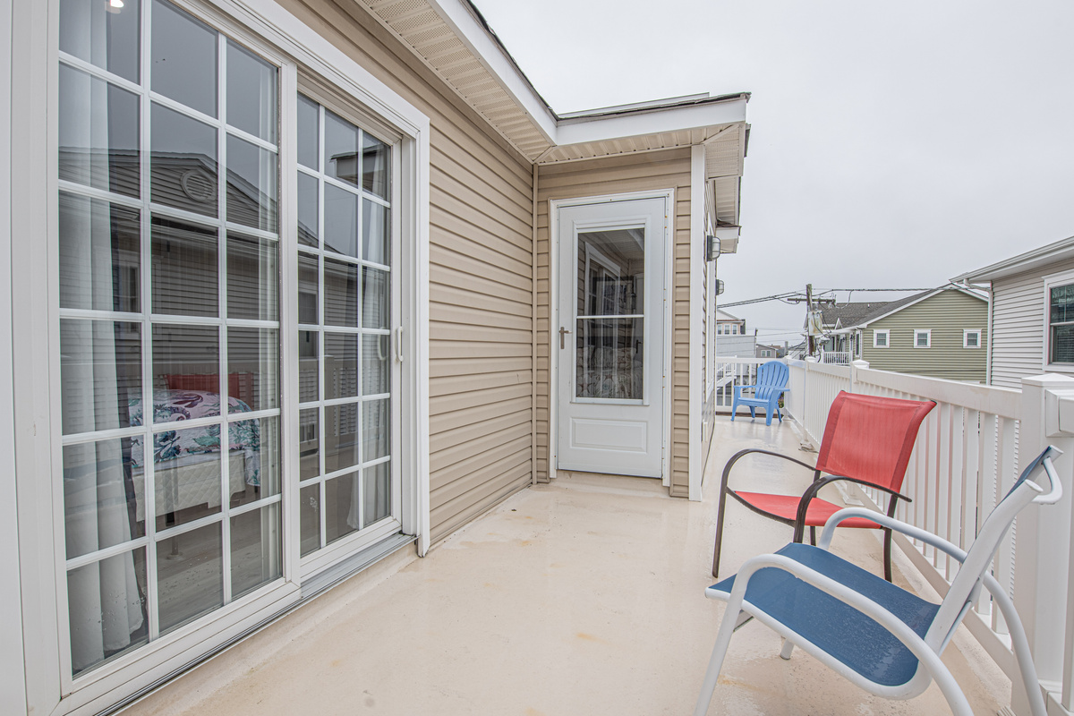 Private Deck with Seating and Sliding Glass Door