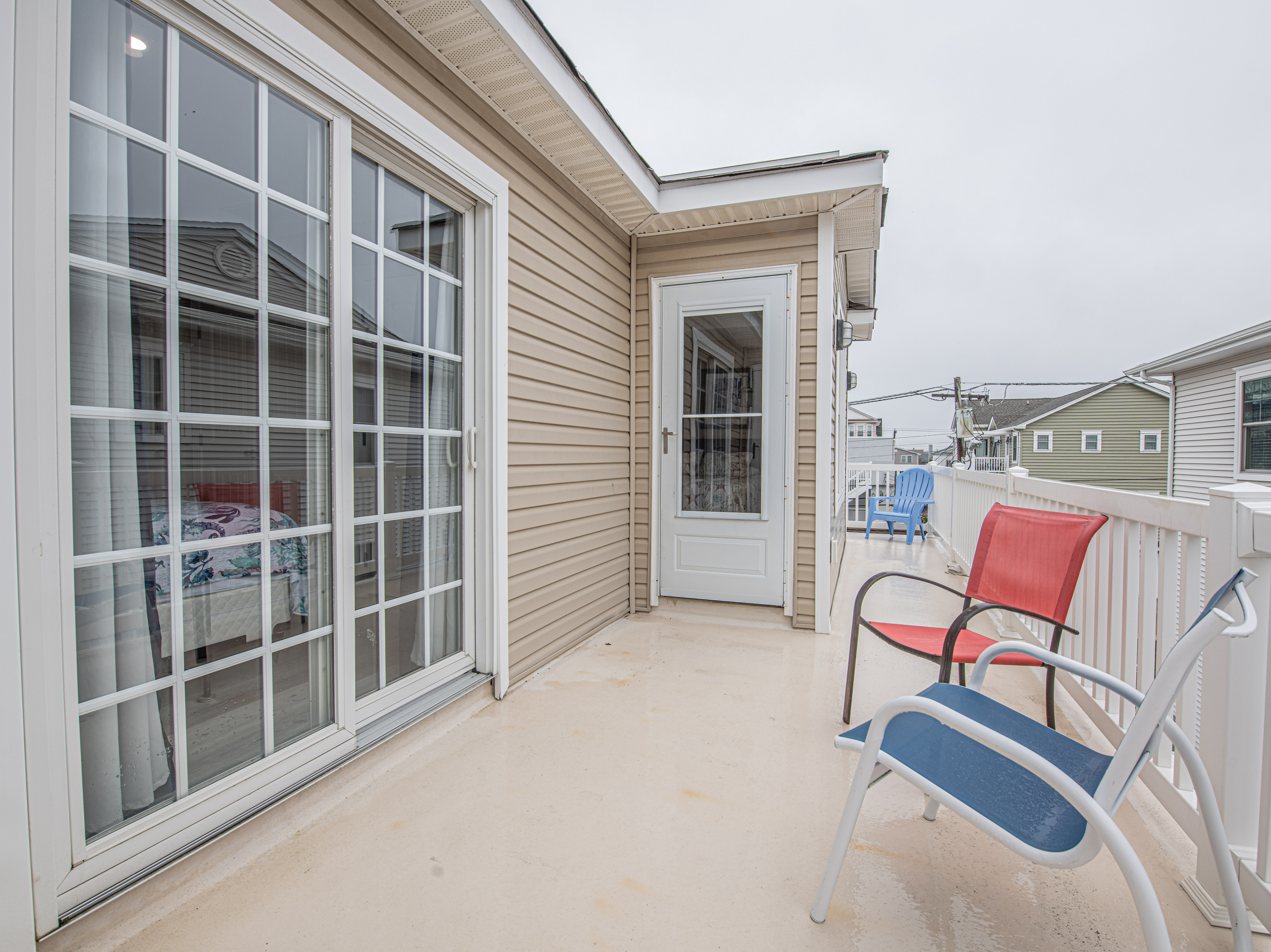 Private Deck with Seating and Sliding Glass Door