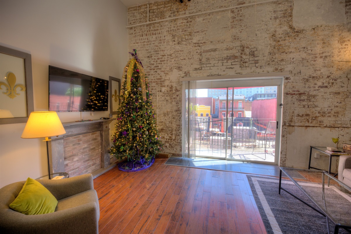 Looking into spacious living room from kitchen: 55" flat screen, cable included.