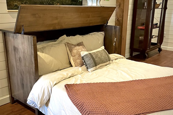 Custom console bed opens into a comfortable sleeping space for additional guests