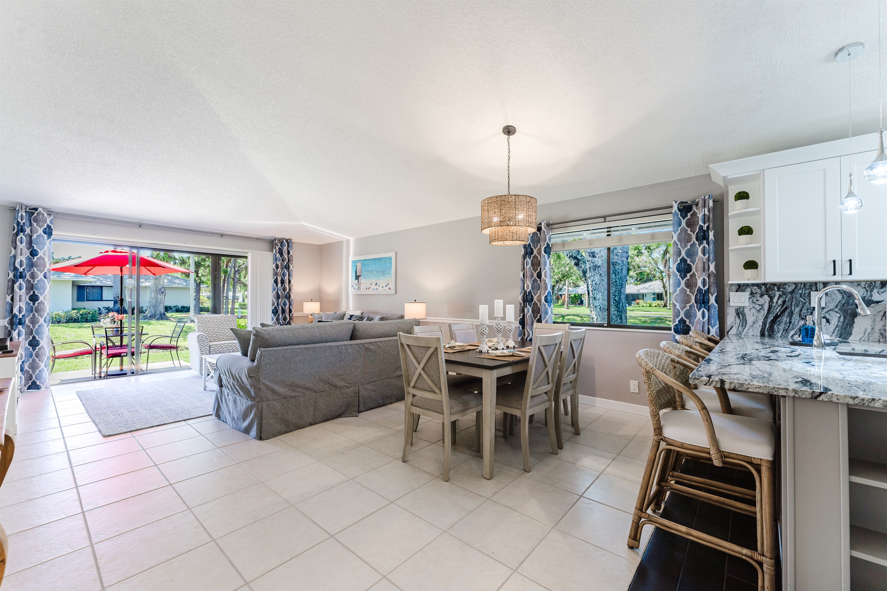 Bright open-concept living with dining for 6 and a fully upgraded kitchen featuring modern finishes, breakfast bar seating, and everything you need to cook and entertain
