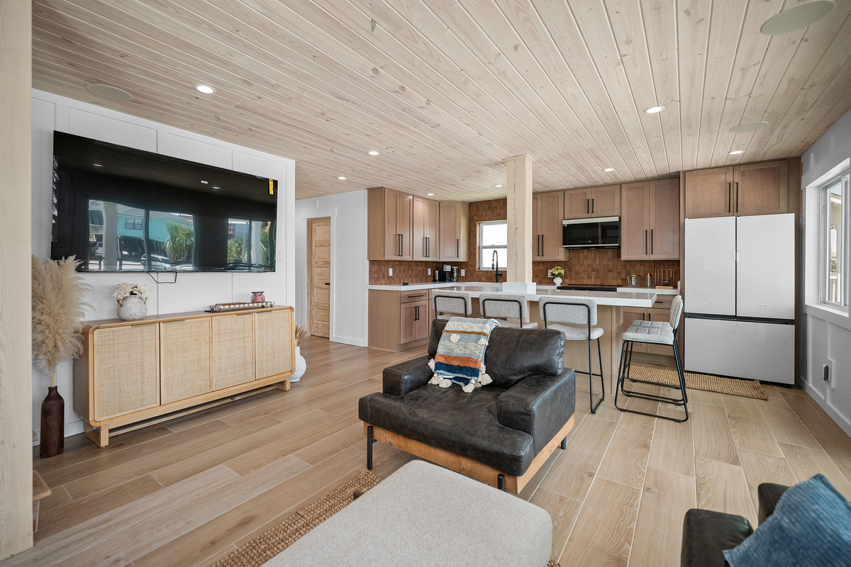 Bright, open living space keeps the kitchen and family hangout area connected.