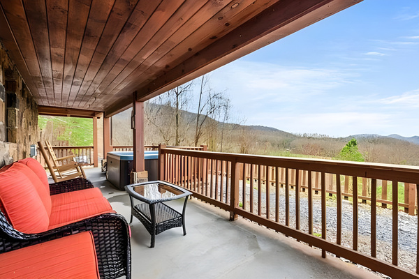 Unwind on the covered patio in the cozy outdoor seating, or take a soak in the hot tub.