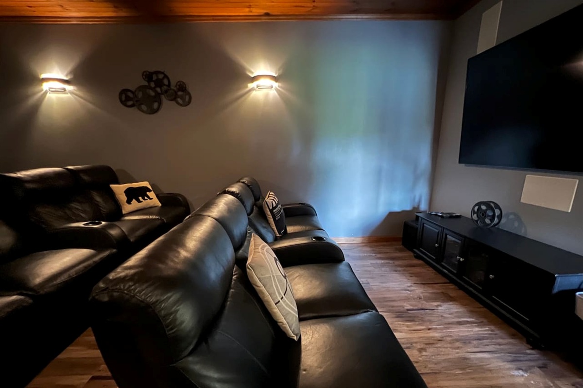 Movie night is on in the theater room! Featuring 3 rows of reclining seats (last row not pictured here). Private theater room is adjacent to rec room with pool table & more.