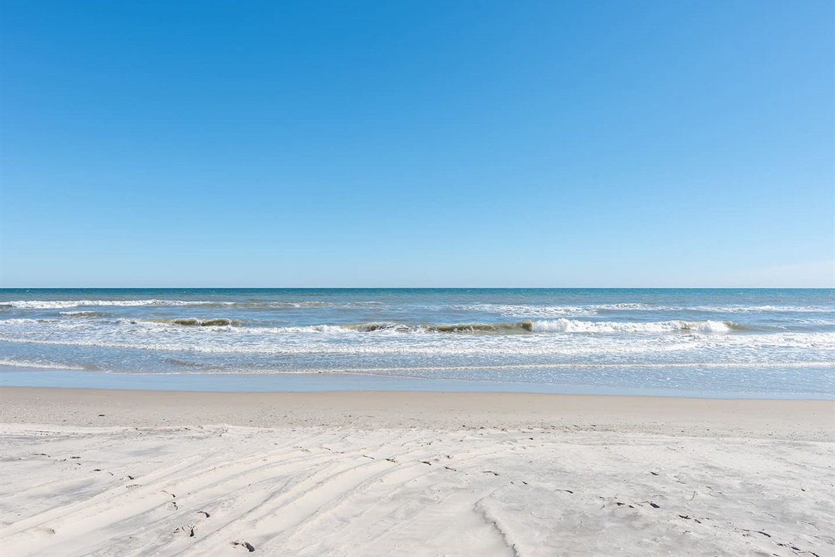 The beach is nearby, offering miles of sand and surf for a relaxing day by the water.