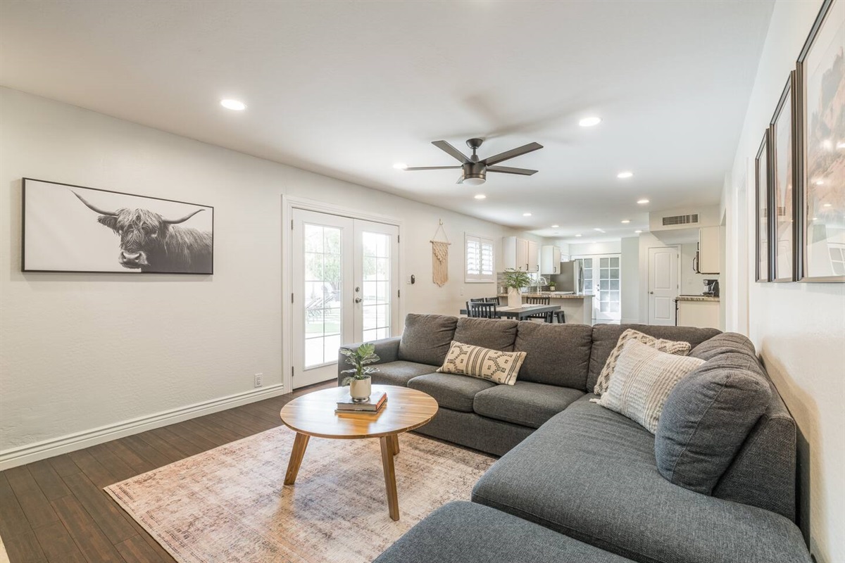 Family room has a large sectional with a QUEEN SOFA BED.