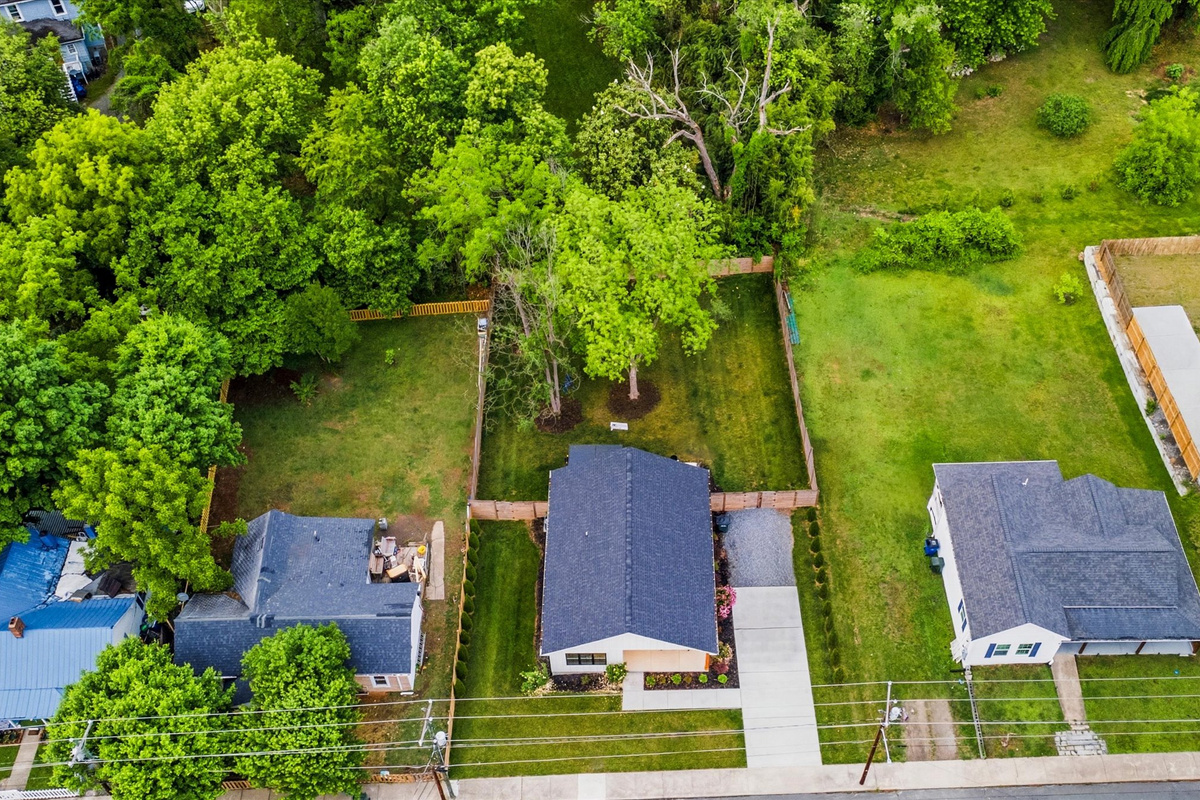 The fenced backyard gives everyone room to relax, play, and spread out.