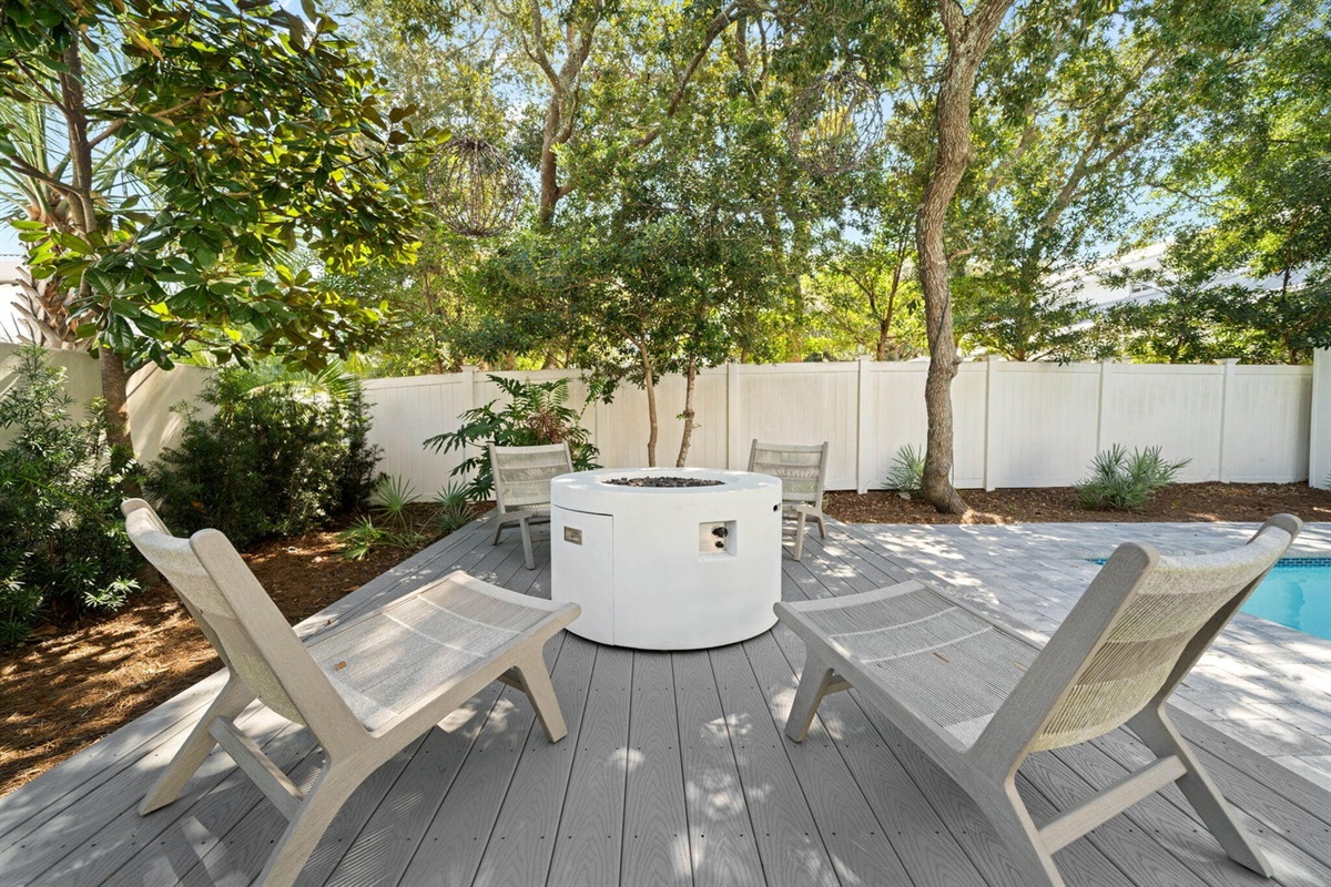 Fire pit, enjoy smores or a glass of wine under the starry-lit oak trees.