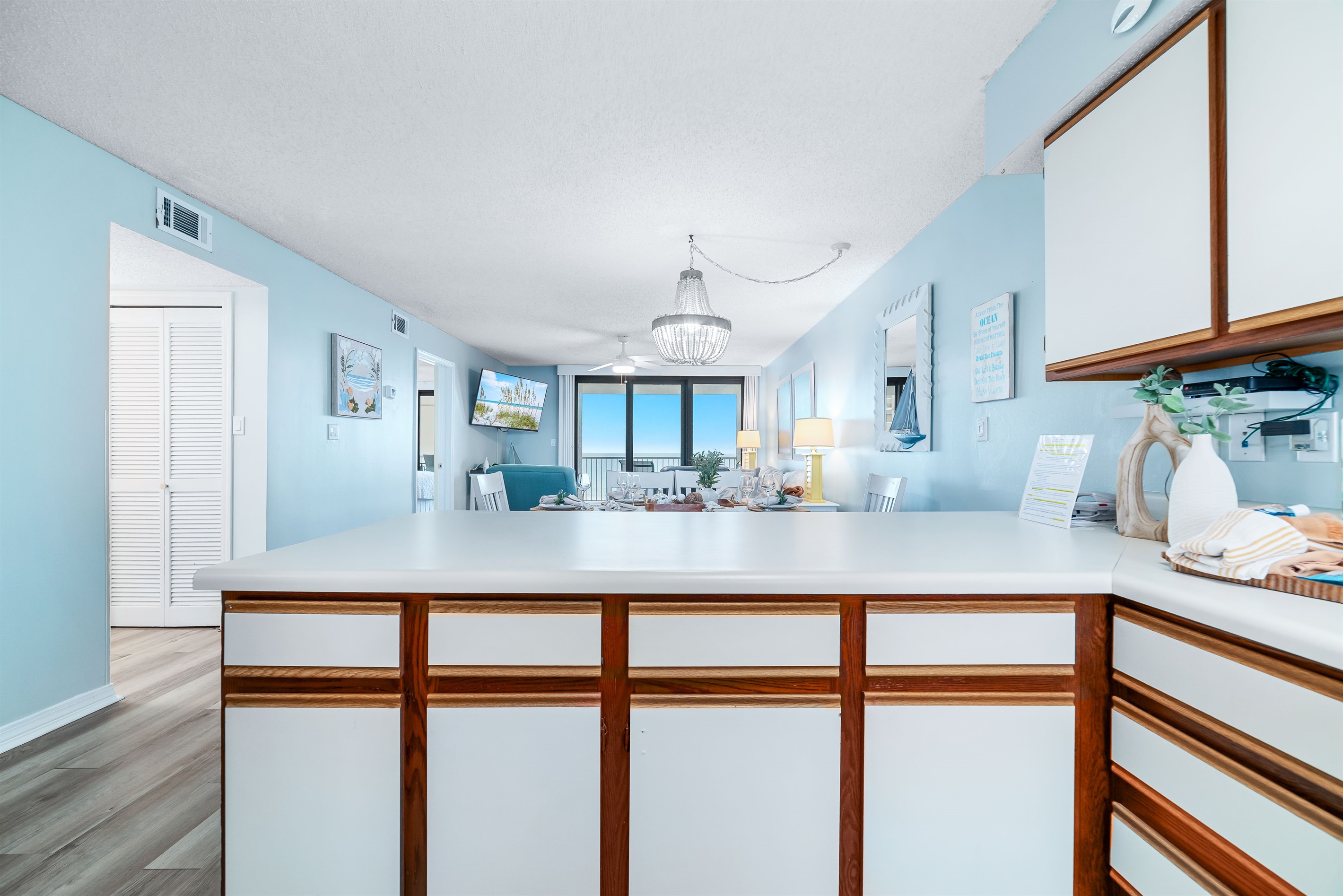 The kitchen island takes center stage, offering ample counter space and casual seating. Perfect for meal prep, entertaining, and everyday living.