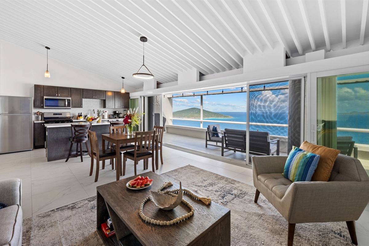 Open plan kitchen into dining and living room - all with a gorgeous view