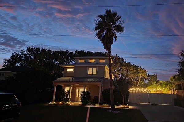 Nighttime view of the front of the house