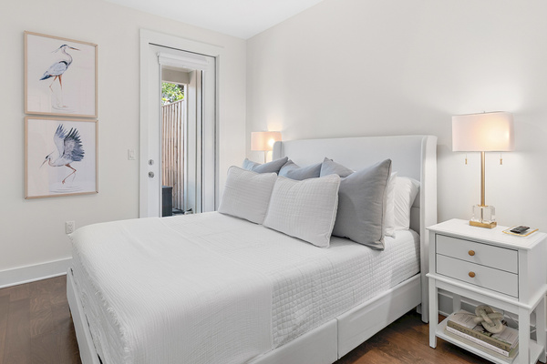 Bedroom #2 offers comfort and convenience with private access to the backyard, a Smart TV, sound machine, and phone charger—creating a relaxing retreat with everything you need to unwind after a day of 30A fun.
