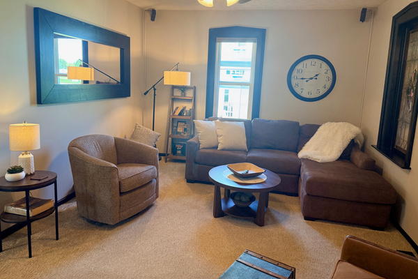 Sitting room with comfortable chairs and a cozy conversational layout.