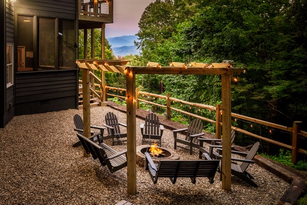 Gather Around the Fire Pit Under the Pergola—Cozy Seating, String Lights, and Mountain Views.