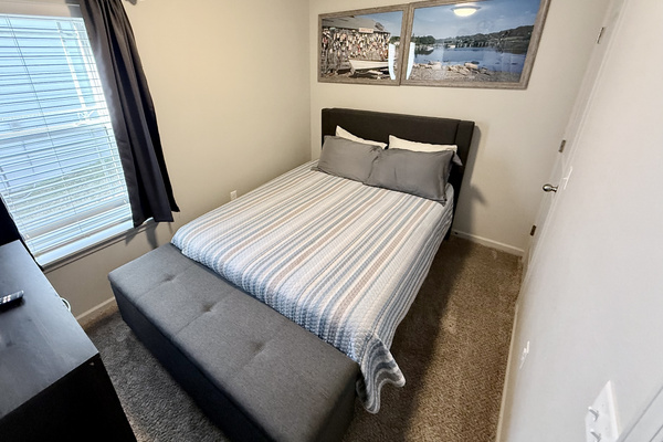 Bedroom 2 with Queen size bed and a place to sit at end of bed