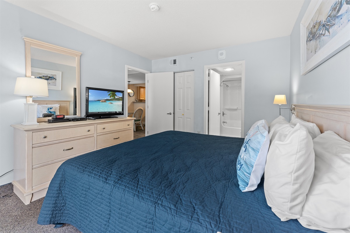 Main Bedroom with king bed, on suite and access to balcony