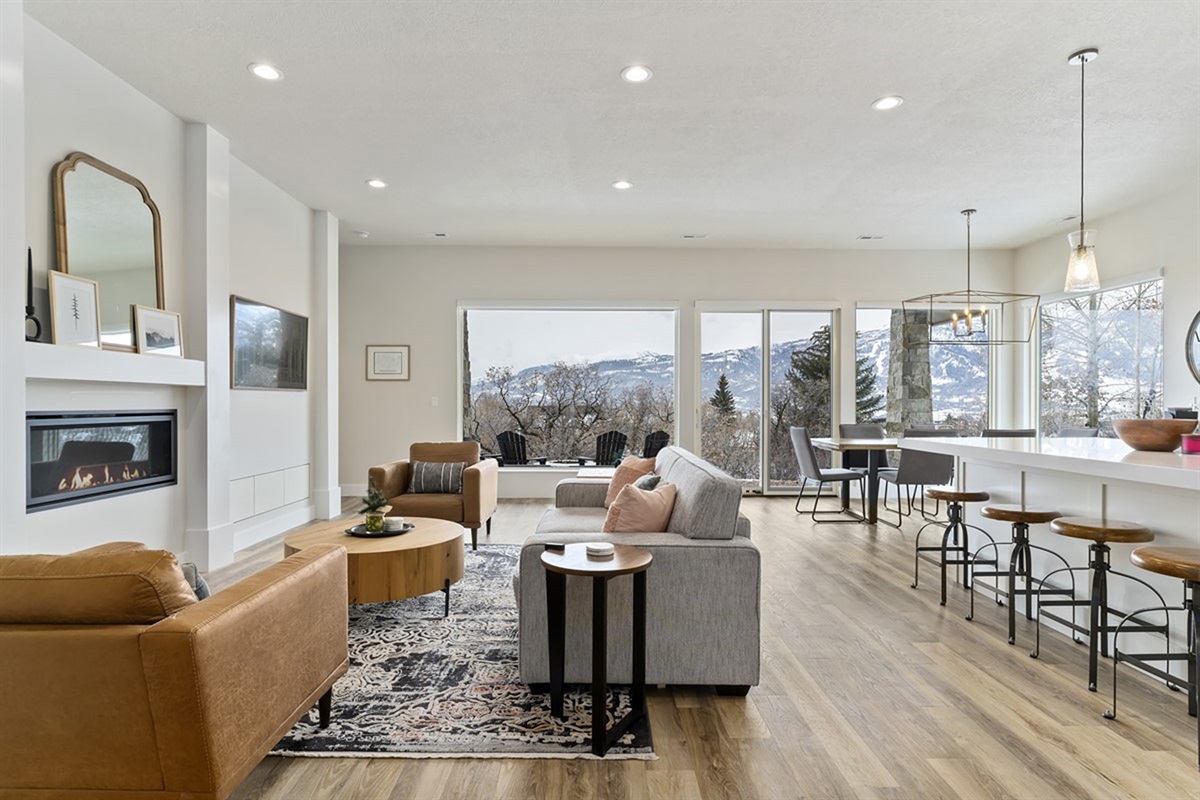 Relax by the fireplace or take in the views from the living area—this space blends comfort with style.