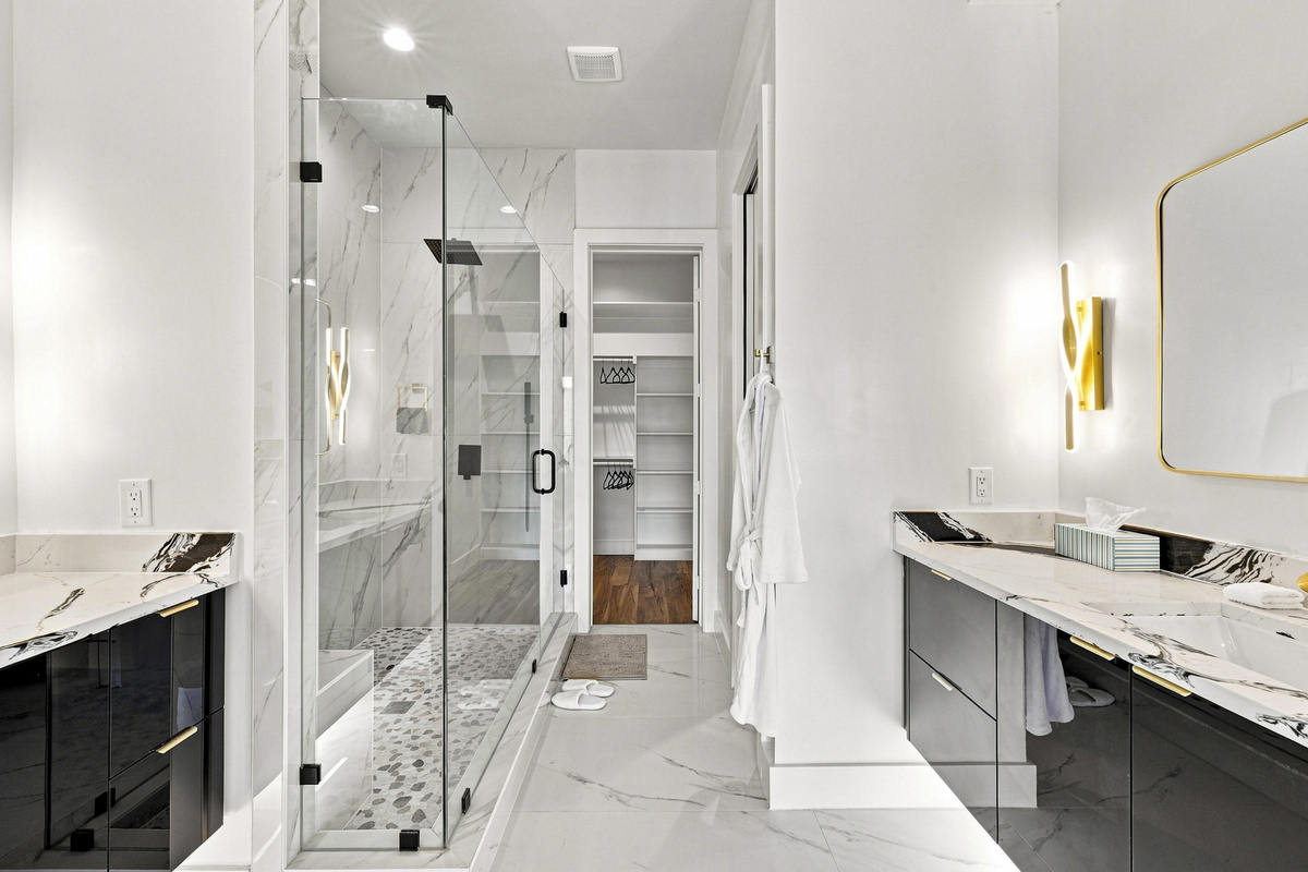 Indulge in a spa-like retreat with stunning marble and sleek, modern finishes!