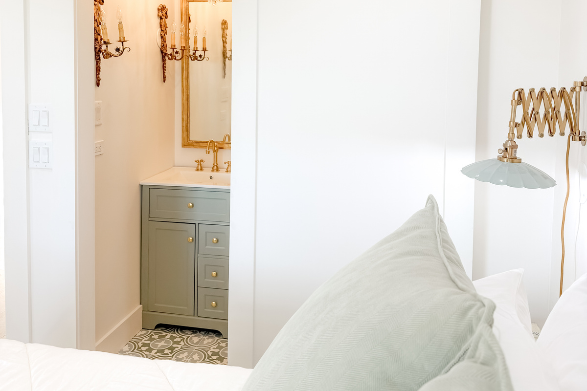 Bright and inviting main bedroom with a queen bed and natural light.
