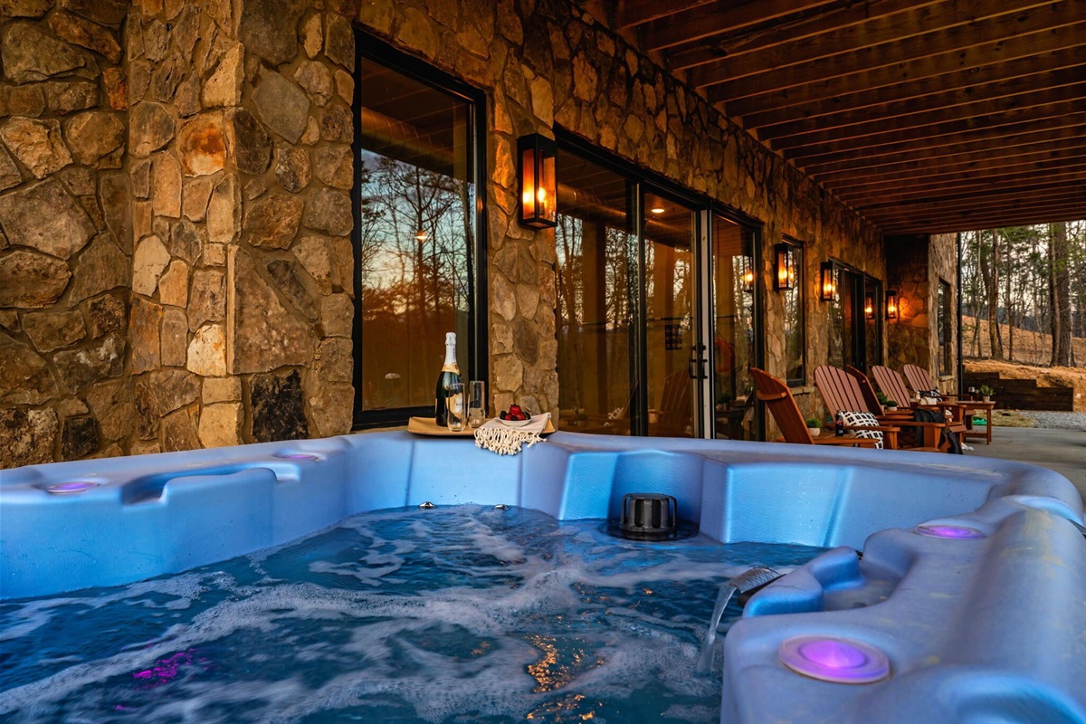 Enjoy the hot tub while others relax nearby in our back porch seating 