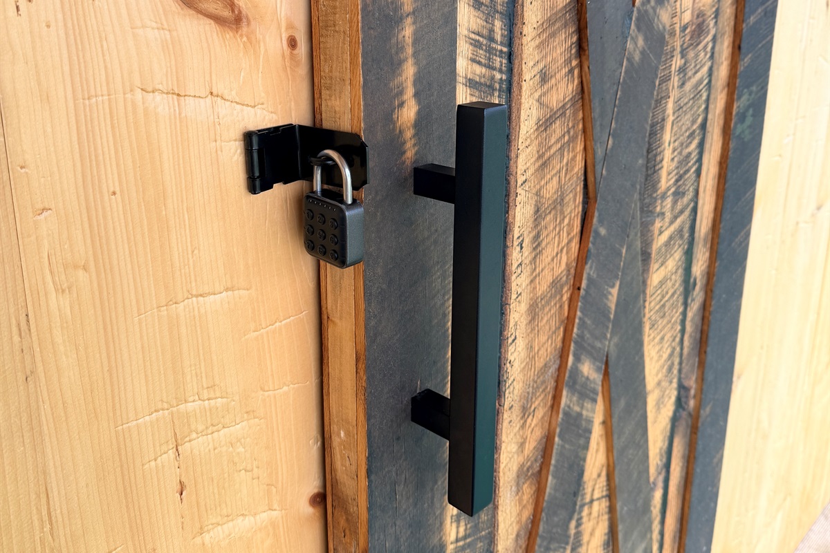 This upgraded sliding barn door provides a solid, lockable entrance to the tent, offering guests an added layer of privacy and security while enjoying the unique glamping atmosphere.