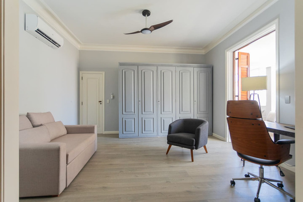 Sitting room for primary bedroom.  Historic shutters leading to covered terrace.   Pull out full sofa bed. 
