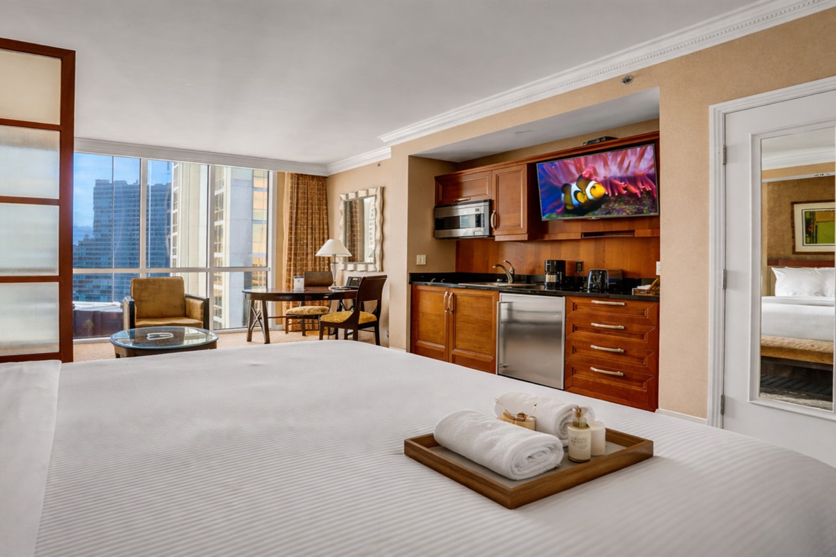 Unwind in this plush king bed with dazzling city views right from your room.