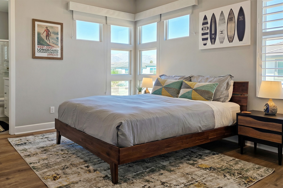 Bedroom #3 showcases tranquil lake views and an ensuite bathroom with a walk-in shower.